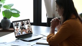 Virtual meeting. Caucasian successful woman, sit in office, having online financial brainstorm via video conference with successful colleagues, discuss financial plan, focused listens to