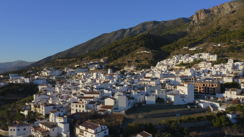 Aerial Drone View of Spain, Spanish Town in Mountains, Costa Del Sol, Andalusia (Andalucia), Europe, Traditional White Houses and Homes Popular in Property Real Estate Housing Market, Europe Royalty-Free Stock Footage #1093315967