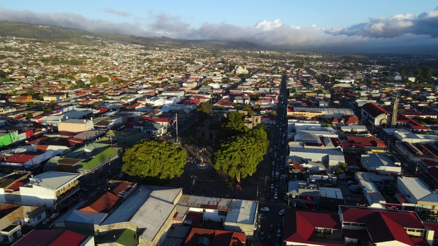 Beautiful aerial cinematic footage of the ruins, the CostaRican Flag, and the Bicentennial monument in Cartago Center  in Costa Rica