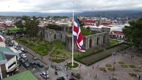Beautiful aerial cinematic footage of the ruins, the CostaRican Flag, and the Bicentennial monument in Cartago Center  in Costa Rica