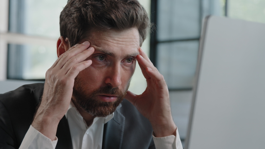 Ill tired frustrated Caucasian bearded 40s business man worker upset sad manager feel stressed look at computer screen suffer from lost job bad news worried of problem failed startup trouble in | Shutterstock HD Video #1093323945