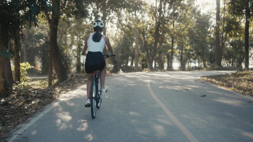 cyclist girl training. Cyclist Woman in Helmet on Bike