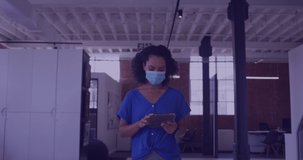Animation of clouds with uploading over biracial female doctor in face mask. Health, medicine, cloud computing and data processing concept digitally generated video.