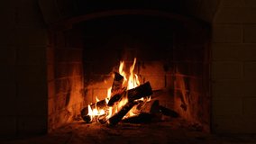 Cozy Relaxing Fireplace. TV Screen Saver. A Looping Clip of a Fireplace with Medium Size Flames Christmas Holidays Concept. Video for Meditation Background clip
