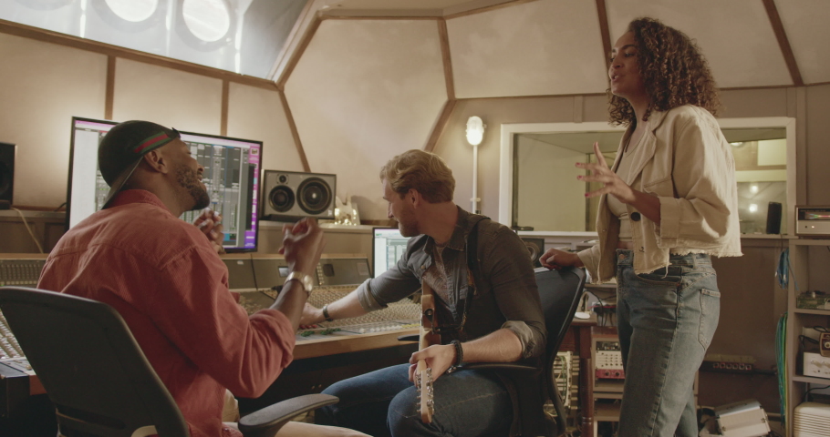 Band Composing with Producer in Music Recording Studio | Shutterstock HD Video #1093336855