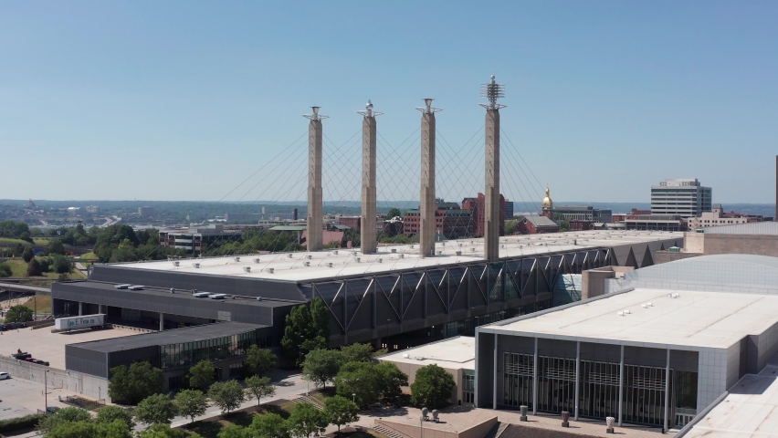 Close-up push-in aerial shot of the Convention Center complex in the historic Power and Light District of Kansas City, Missouri. 4K
