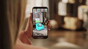Decorating Apartment: Woman Holding Smartphone, using Augmented Reality Interior Design Software Chooses 3D Furniture for Home. Pick a Stylish Chair for the Living Room. Over Shoulder Close-up Screen - Powered by Shutterstock - Get 15% off with code: PIKWIZARD15