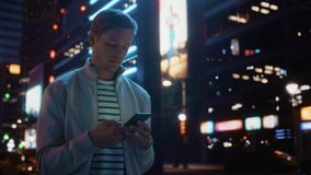 Man Using Smartphone Walking Through Night City Street. Man Using Mobile Phone, Infographics Show: Social Media Stream, Online Shopping, News, Videos, Gaming, Dancing. 3D VFX Graphics, Animation