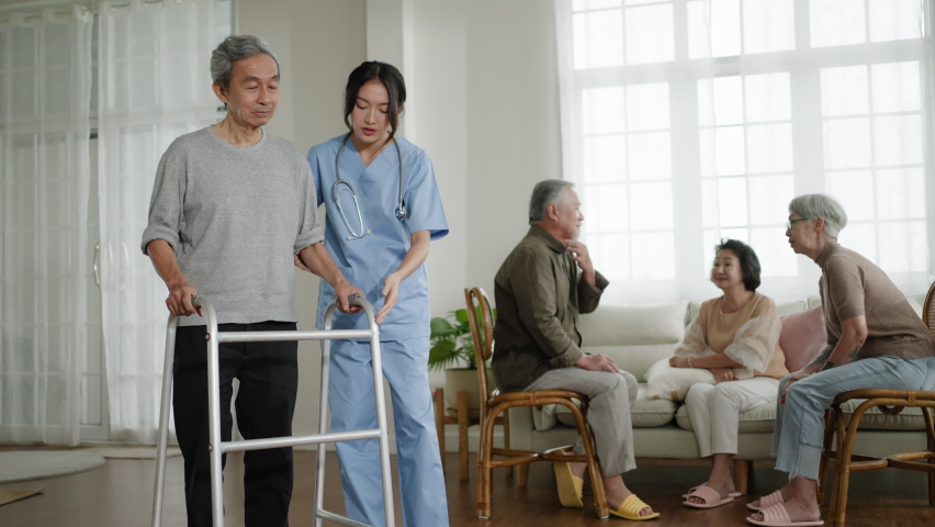 nurse woman walking with senior man with mobility walker in living area of nursing home senior daycare center,doctor woman assisting old man activities in retirement home Royalty-Free Stock Footage #1093345775