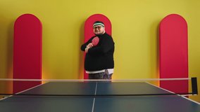 Good looking fat man in front of the camera posing and crossing hands before start to play on the table tennis he smiling charismatic and wearing sunglasses - Powered by Shutterstock - Get 15% off with code: PIKWIZARD15