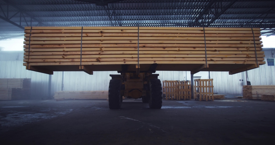 Loader work in the warehouse. Transportation of lumber, building materials. Royalty-Free Stock Footage #1093365119