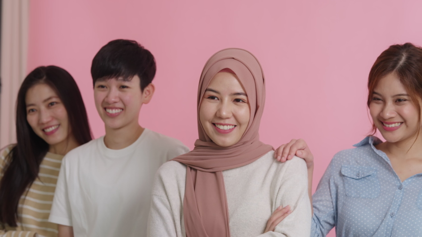 Diverse group of young asia Gen z girl arm cross happy face look at camera in model shooting studio shot. Power of people woman's day right or gay youth LGBT pride unity team strong cool proud smile. | Shutterstock HD Video #1093366469