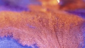 Bokeh glitter background. Blur sparkles. Fantasy waterfall. Defocused gold orange neon blue color shiny sequin scattering abstract grain texture. - Powered by Shutterstock - Get 15% off with code: PIKWIZARD15