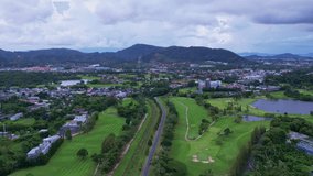 Aerial Drone video hyperlapse of road and kathu city Phuket thailand transportation footage background 4K Time lapse Transportation concept