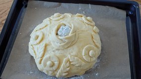 The process making homemade bread loaf. Baker shows bread festive loaf dough flowers and leaves, making bread using traditional technique. Slavic wedding traditions. Step by step - Powered by Shutterstock - Get 15% off with code: PIKWIZARD15