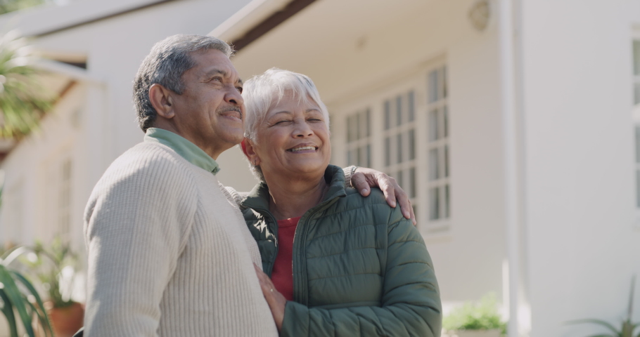 Loving, happy and joyful mature or old lovers with a retirement investment in property. New house, home loan or bank loan approved for a senior couple standing outside their home on a weekend. | Shutterstock HD Video #1093375179