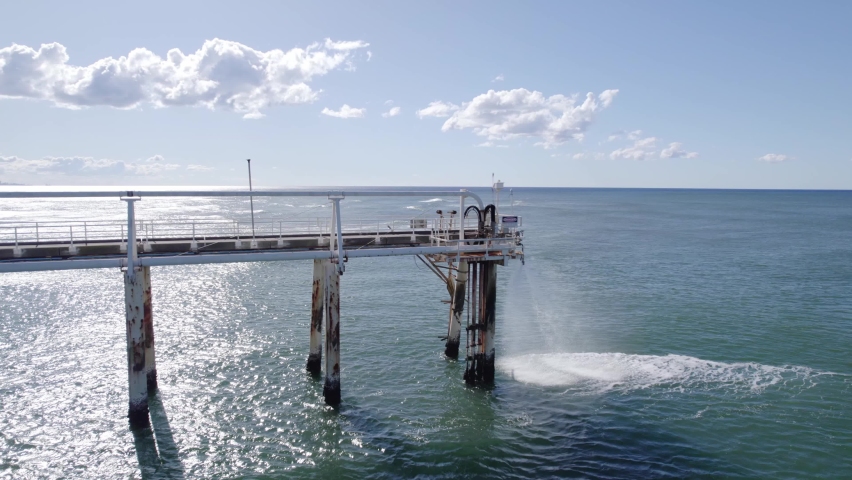 Sand-water Mixture Being Pumped Out From Tweed River Entrance Through Sand Bypassing Facility On TSB Jetty In Australia. drone orbit Royalty-Free Stock Footage #1093379431