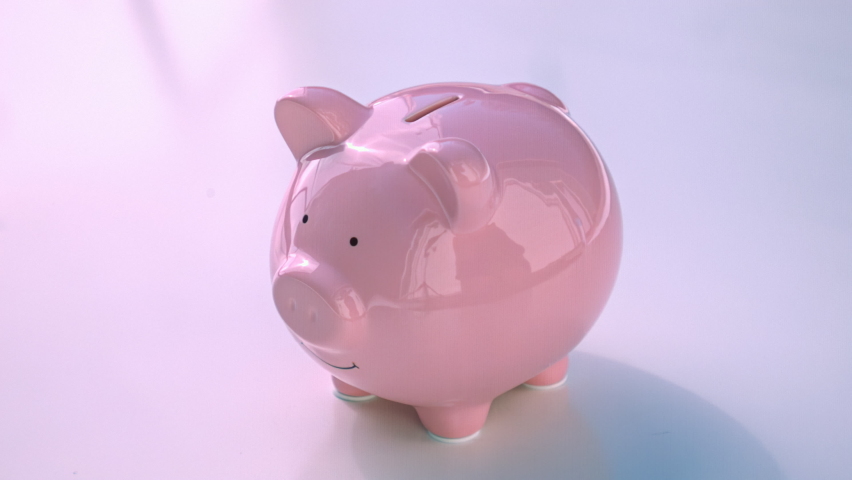 Smashing a pink ceramic piggy bank full of change in 1000fps slow motion Royalty-Free Stock Footage #1093389219