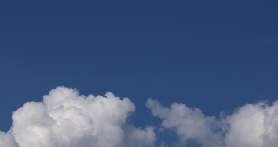 Cloud time lapse. Blue sky white clouds. Puffy fluffy white clouds. Blackmagic 6k pro , prores 422.