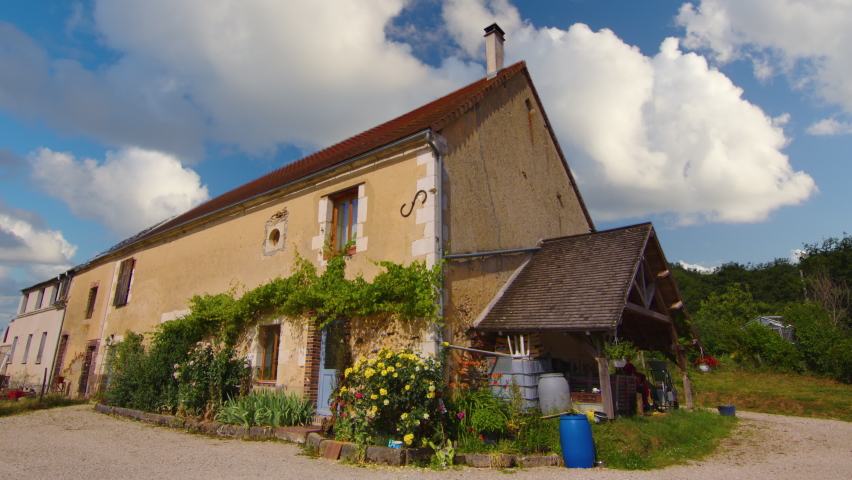 French old house. Legacy of French history. Timelapse of a French village, clouds over a historic house. Historic suburb of Paris. Royalty-Free Stock Footage #1093404683
