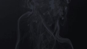 Slow motion of wooden fire smoke in black background, beautiful fog motion. Filmed on cinema camera, 8K downscale, 4K.