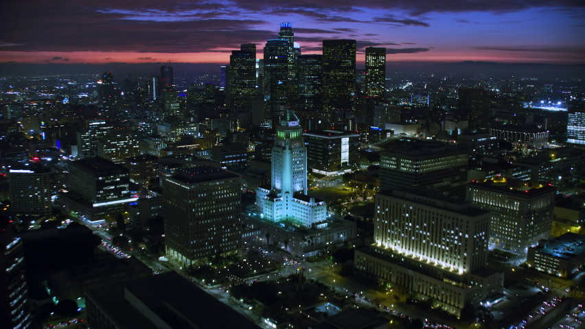 Aerial View of the Financial District in Downtown LA. Famous Skyscrapers At Night, Los Angeles City Hall. United States. Shot in 8K.  Blurred logos and Brands Royalty-Free Stock Footage #1093407623