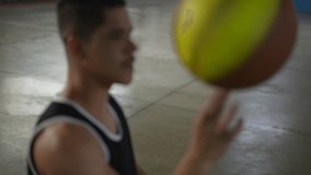 Athlete spinning basketball ball with finger. Handicapped athlete in wheelchair spins ball with hand - Powered by Shutterstock - Get 15% off with code: PIKWIZARD15