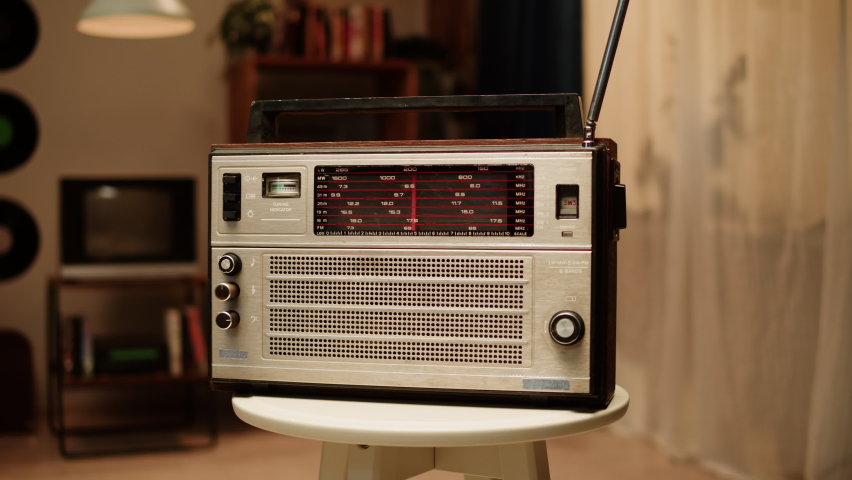 Vintage FM radio, Retro radio tape recorder close-up. Listening to music, old radio boombox player, searching channel.  Royalty-Free Stock Footage #1093415151