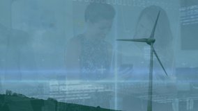 Animation of financial data and businesspeople over wind turbine. Eco power, green energy, global finance and economy concept digitally generated video. - Powered by Shutterstock - Get 15% off with code: PIKWIZARD15