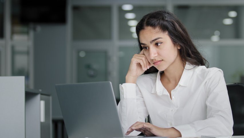 Young stressed tired overworked female office worker working on laptop suffering from eye fatigue massages bridge of nose feels tense headache from overwork having painful feeling exhausted Royalty-Free Stock Footage #1093430599