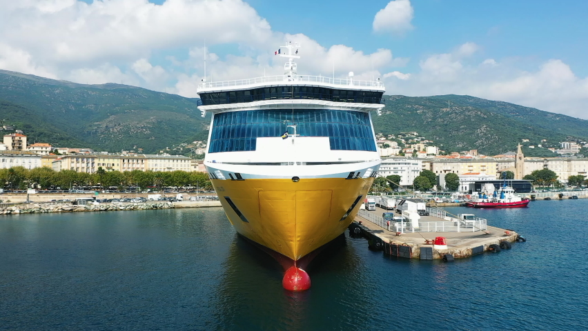 A boat in the port of the city of Bastia , in Europe, in France, in Corsica, by the Mediterranean Sea, in summer, on a sunny day.