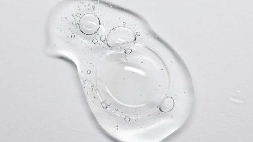 Close up Clear liquid cosmetic product. Gel texture with bubbles, skin care prodict | Shutterstock HD Video #1093433229