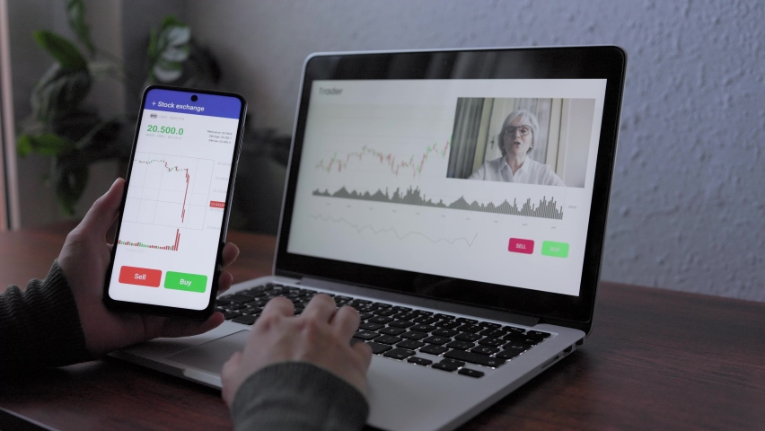 Trader using cryptocurrency exchange for investment on stock market at hedge fund office