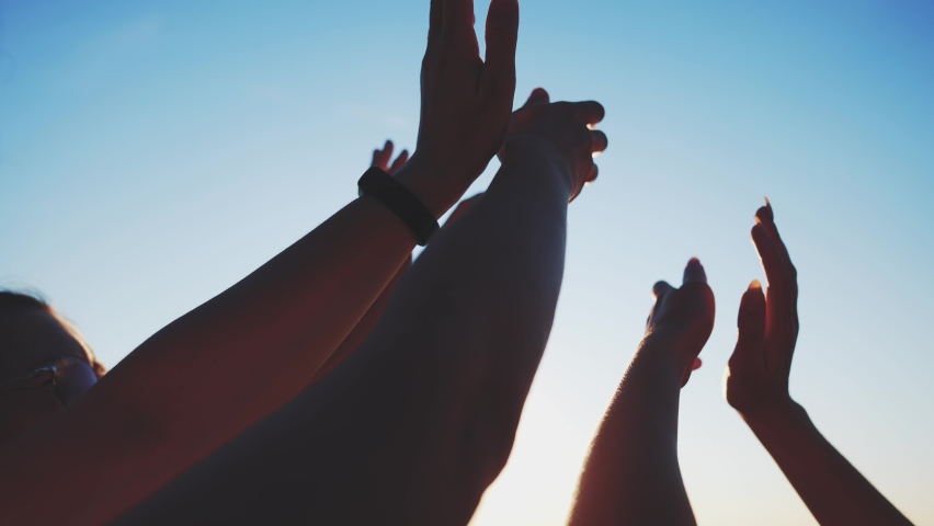 group of cheerful people together party pulling hands to the sun on the beach. teamwork. silhouette people party dancing recreation holiday. fun people music. pull their hands up. religion concept Royalty-Free Stock Footage #1093437923
