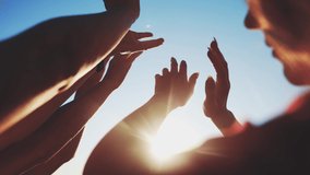 group of cheerful people together party pulling hands to the sun on the beach. teamwork. silhouette people party dancing recreation holiday. fun people music. pull their hands up. religion concept - Powered by Shutterstock - Get 15% off with code: PIKWIZARD15