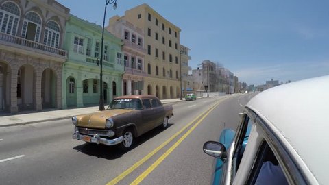 Driving in the famous Malecon Avenue, Havana, Cuba