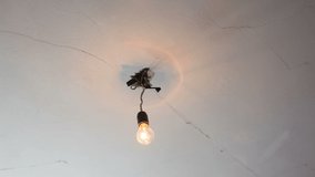 An incandescent lamp flickers in an old house. Voltage fluctuations in the electrical network. light bulb flickering
 - Powered by Shutterstock - Get 15% off with code: PIKWIZARD15