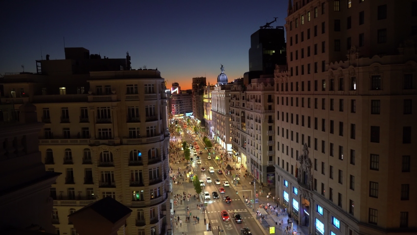(HIGH ANGLE) Panoramic view of Madrid's Gran Vía in summer and at night. Madrid, Spain, August 19, 2022. Royalty-Free Stock Footage #1093472205