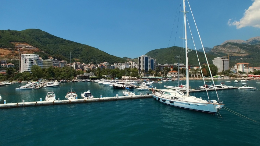 Pier with yachts off the coast of Budva, Montenegro | Shutterstock HD Video #1093472611