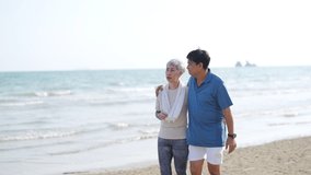 4K Happy Asian senior couple jogging exercise together on the beach in summer morning. Healthy retired man and woman enjoy outdoor lifestyle sport training running workout on beach holiday vacation. - Powered by Shutterstock - Get 15% off with code: PIKWIZARD15