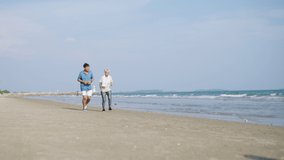 4K Happy Asian senior couple jogging exercise together on the beach in summer morning. Healthy retired man and woman enjoy outdoor lifestyle sport training running workout on beach holiday vacation. - Powered by Shutterstock - Get 15% off with code: PIKWIZARD15
