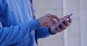 Animation of social media reaction over hands of caucasian man using smartphone. Social media, network, communication and technology concept digitally generated video.