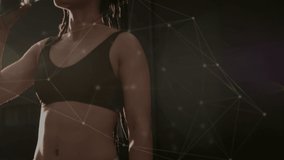 Animation of network of connections over fit biracial woman drinking water. Sport, active lifestyle, connections and technology concept digitally generated video.