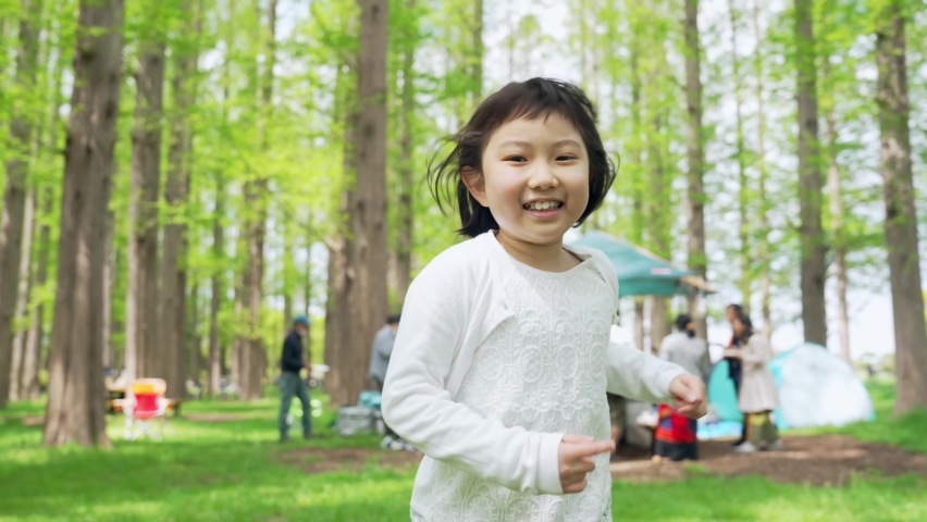 Asian little girl running in the forest. Environment concept. Childcare. Sustainable lifestyle. Royalty-Free Stock Footage #1093482281