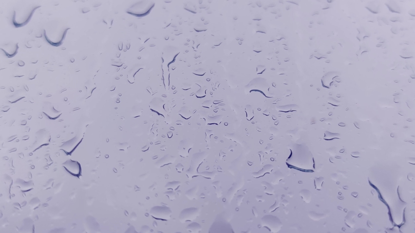 Window with Natural Glass Background. Close-up of Water Drops on Glass, Rain. Large Drops of Rain hit the Window Glass During a Summer, Autumn Downpour. 4K.