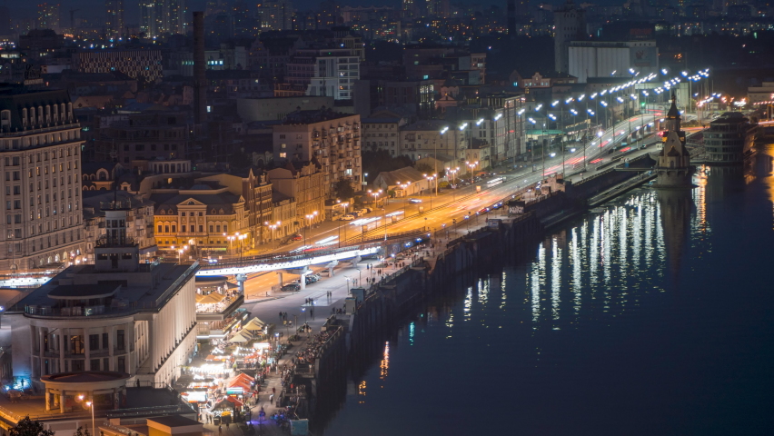 Kyiv. Ukraine. Panorama of the night city of Kyiv. Timelapse. River Port in Kyiv. Night road intersection