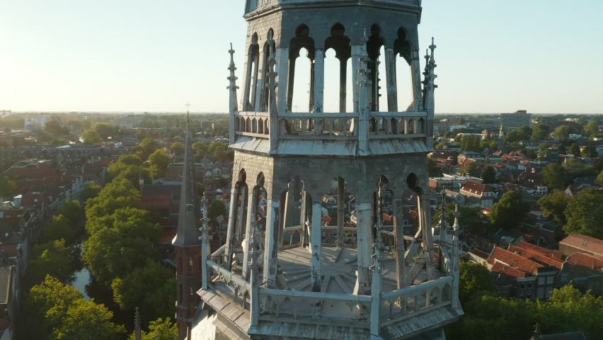 Close Up Of Towering Spires Of Gouwekerk Gothic Revival Church In Gouda, Hoge Gouwe, Netherlands. Aerial Orbiting Shot