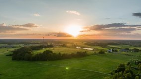 Aerial drone timelapse footage. Amazing sunset over the country.