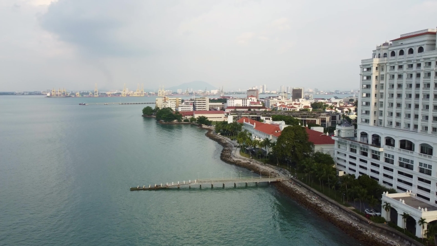 Penang, Malaysia: Aerial drone footage of the coastline of George Town historic city in the island of Penang, the first British settlement in Asia in Malaysia. 
