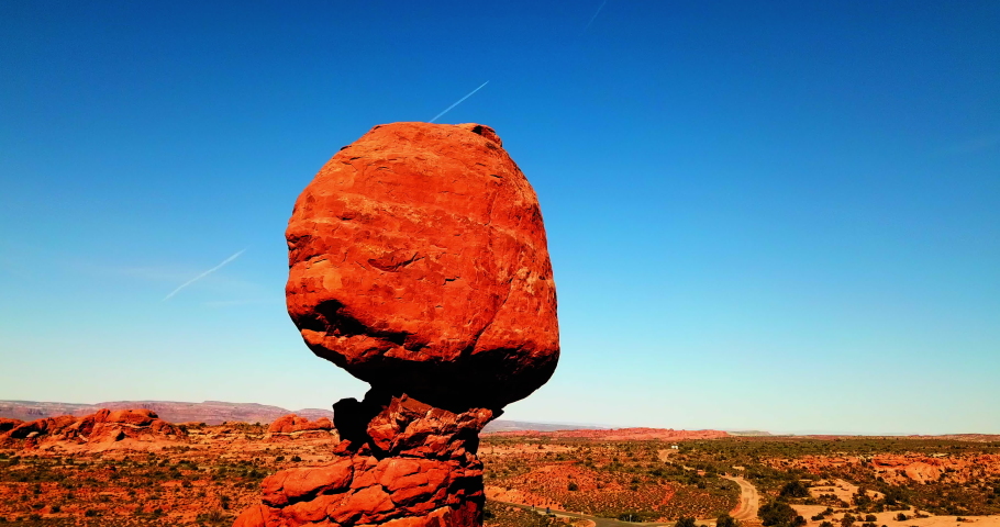Panning Shot Of Balanced Rock At National Park On Sunny Day - Moab, Utah